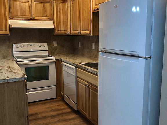 New cabinets, countertops, sink, faucet, and flooring. Kitchen equipped with smooth top stove, dishwasher, garbage disposal, and refrigerator with automatic ice maker.