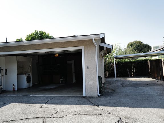 2 Car Garage and extra carport with plenty of space
