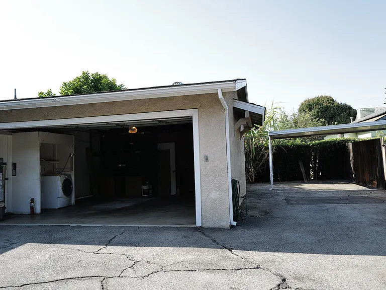 2 Car Garage and extra carport with plenty of space