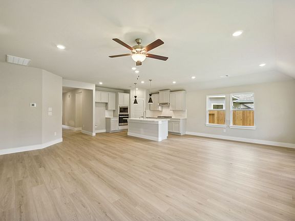 Open concept living in 6915 California Black Oak Drive at Montgomery Oaks in Conroe, Texas.