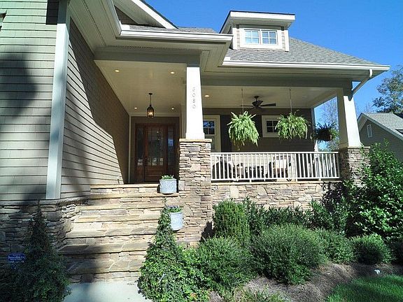 Inviting Covered Porch Entry with Stone Floor