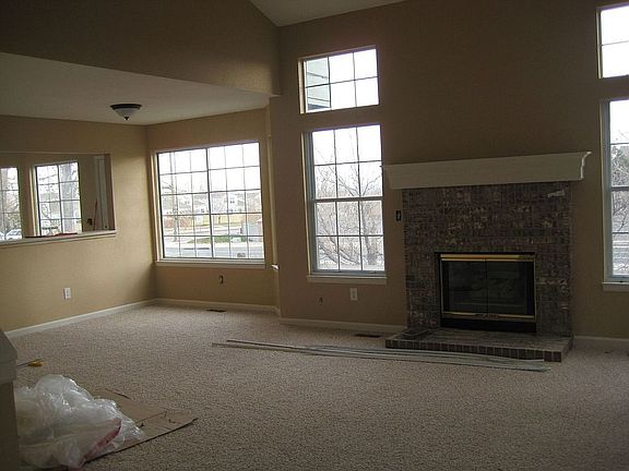 Main living area shows bar open wall that has a bar in the kitchen