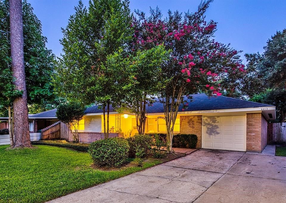 Street view of your new house. Like-new garage door with 2-car driveway. well manicured and healthy front lawn with access to backyard gate pictured right.