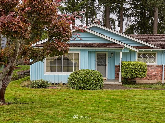 Spacious covered entry leads you into this solid home.  The level lot has mature well tended landscaping.  Move in original condition that is hard to find