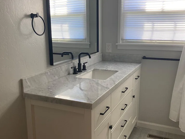 Bathroom vanity with marble top.