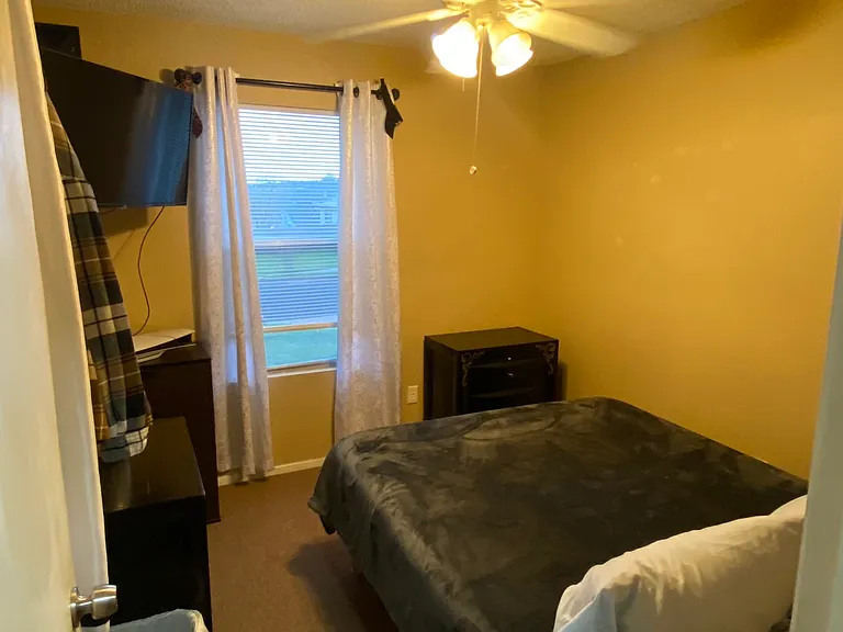 bedroom 1 - now with new carpet! The house is unfurnished but these non-AI pictures show you what it looks like in use.