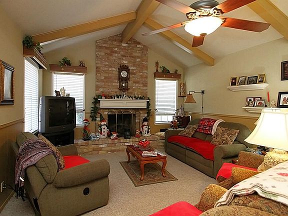  Bright living area with custom paint and chair railing.