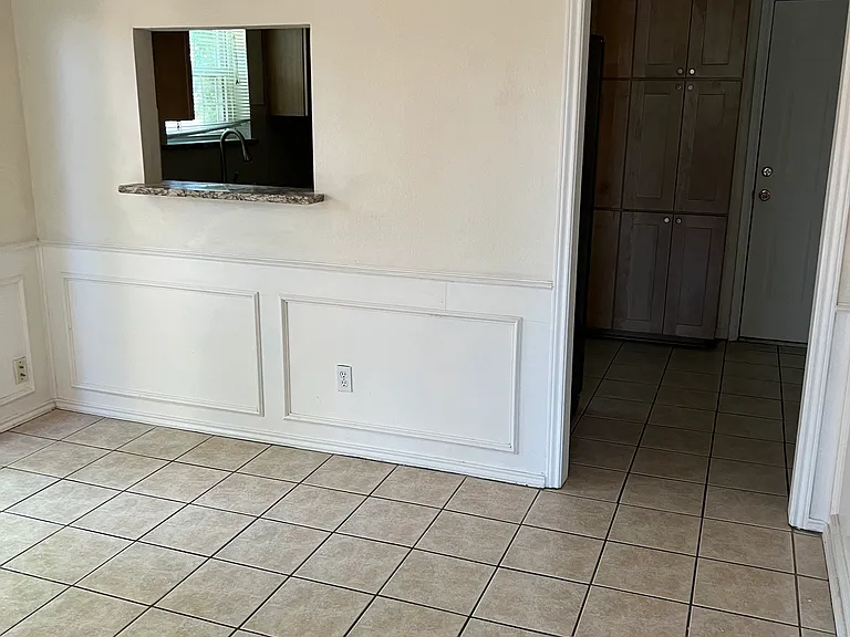 Dinning Area with Entry way to kitchen and back door to garage