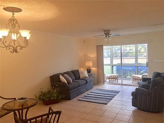 Light bright living/dining room area with greenbelt views.
