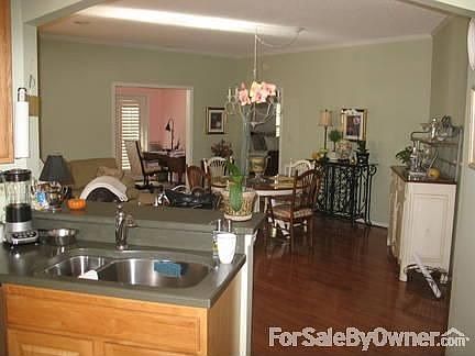 OPEN CONCEPT KITCHEN/DINING/LIVING : View from Kitchen thru Dining into Sunroom and Master
