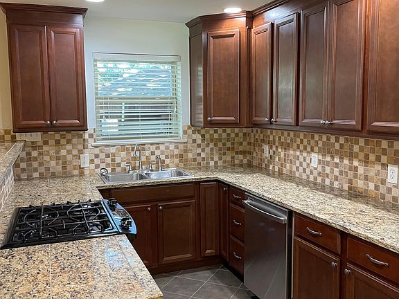 charming kitchen with granite countertop