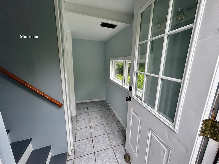 Entrance to tiled downstairs mudroom