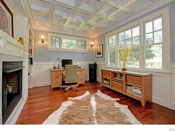 The library is a study in architectural details and custom mill work. Not to miss is the double sided gas fireplace that is open to the formal living room as well.