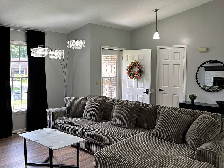 View of living room towards front door.