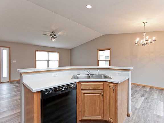 Open floor plan with breakfast bar