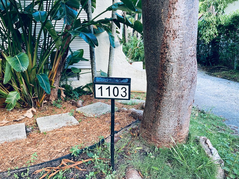Newly Mulched Stepping Stones in very front of this pristine gorgeous Rare Art Deco Home