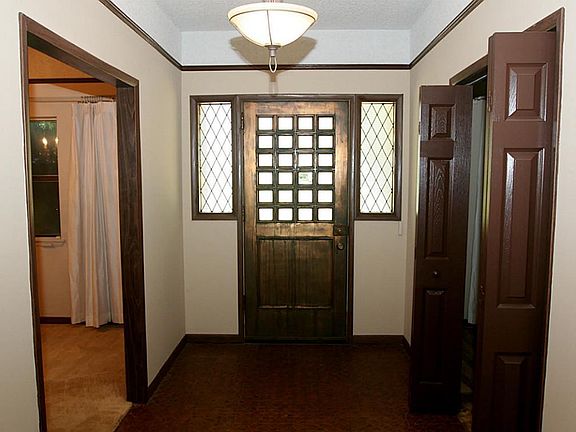 entry way with large heavy weight front door!