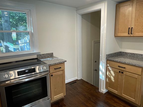 Door to 3 season room, leading to backyard and full footprint LL from the kitchen
