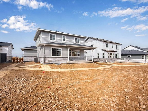 Rear exterior, covered patio and back yard