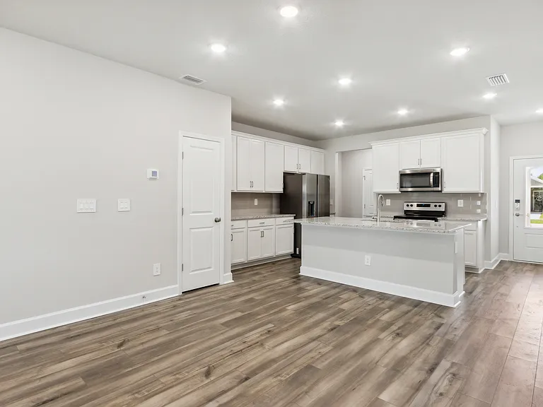 Open kitchen, dining, living space