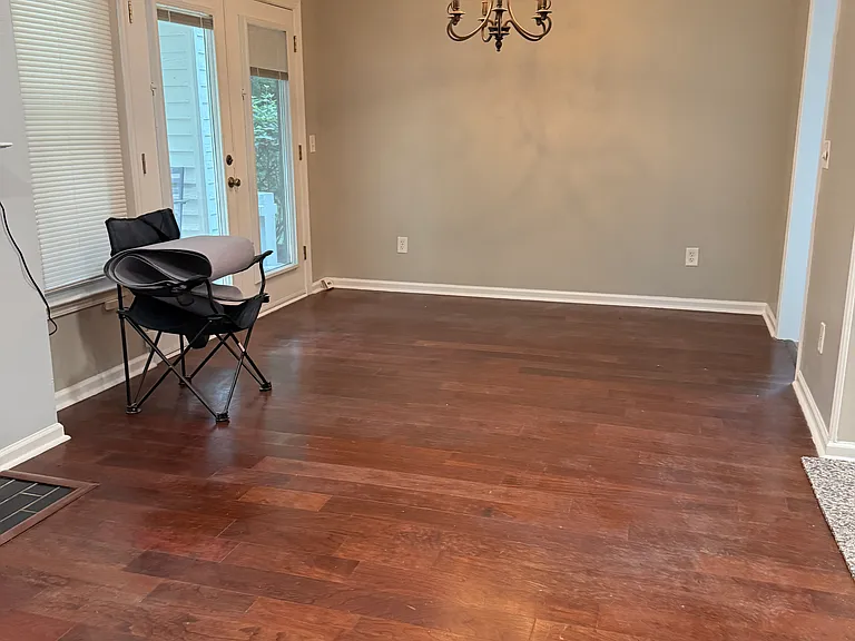 Looking into the dining room. Kitchen to the right and patio to the left.