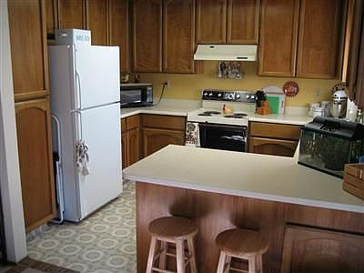 The kitchen is spacious with "tons" of cabinets and counter space!