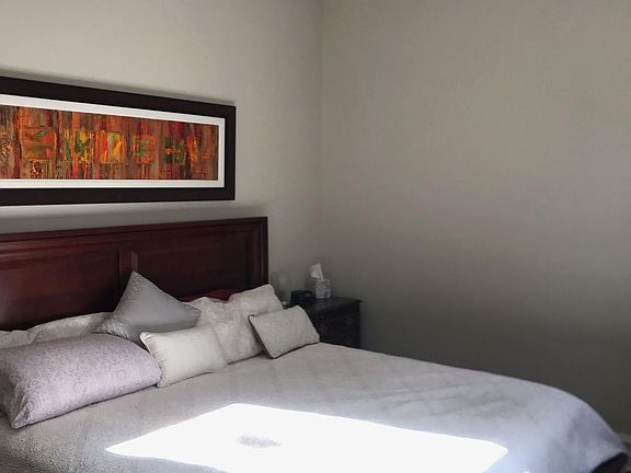 Master bedroom on main level accommodates king bed.