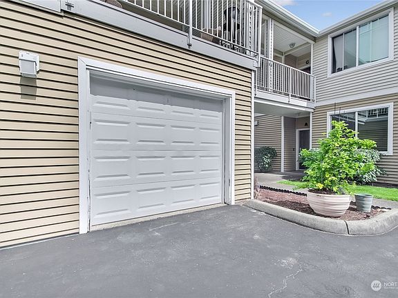 Deep 1 car garage just steps away from your front door. Storage racks in garage stay.>