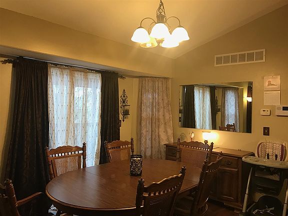 Dining room has sliders to covered deck with a ceiling fan.  Dining room has hardwood floors.