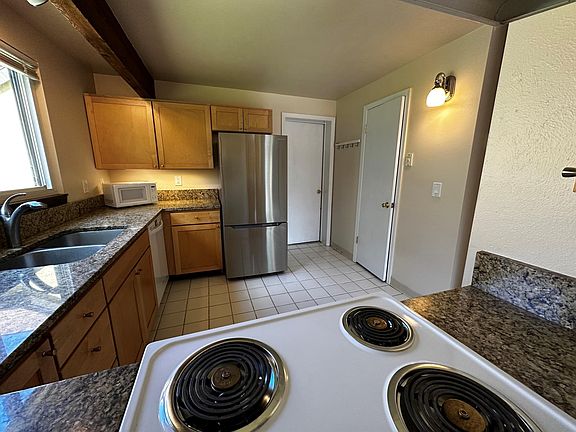large kitchen with door to garage