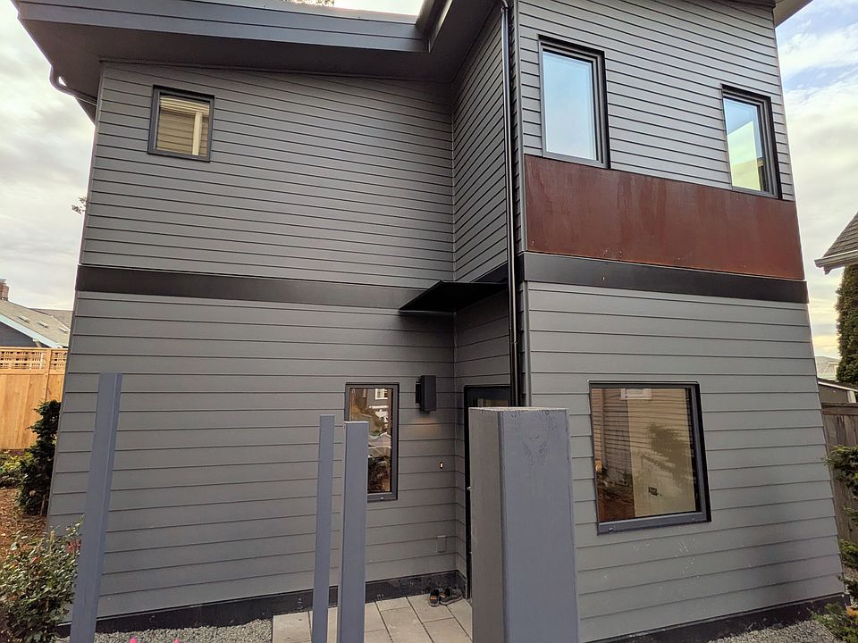 Brand new construction! North side of house with entry door.