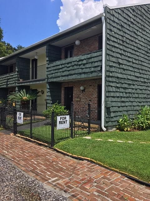 Corner Townhome with front and side yard adjacent to 2 Offstreet parking spaces