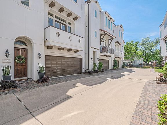 1207 Bonner is conveniently located close to the back gate to the complex. The roomy two car garage has space for additional storage.