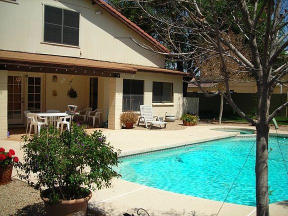 Covered patio and refreshing pool 