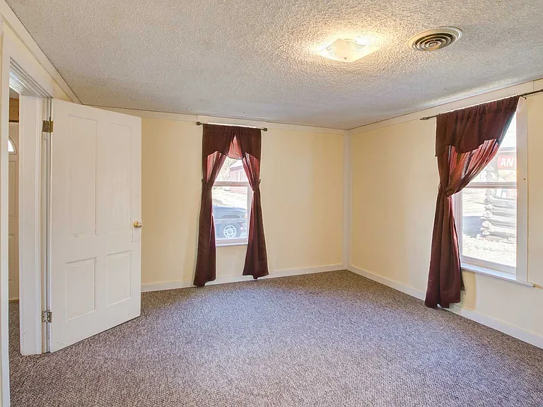 The primary bedroom is in the NW front corner with window views to 5th St and the village.