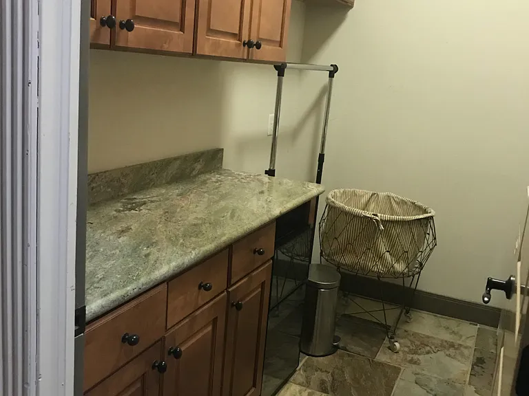 laundry room with washer & dryer, lots of cabinets, and large pantry
