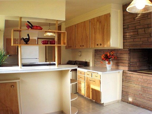 Kitchen with bar eating space.