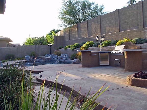 Retreat to a pebble-tec pool, spa, fire pit and cooking island.