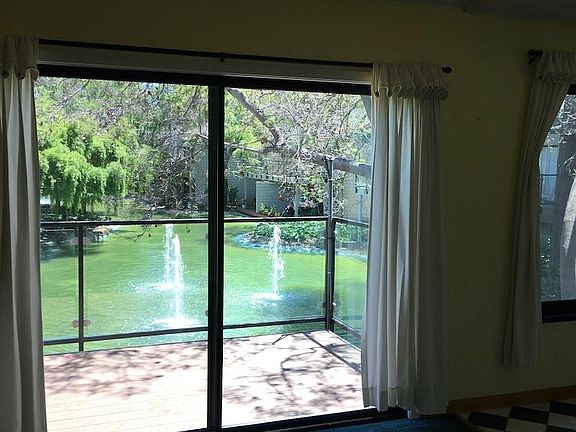 Another lovely view from the living room through the double pained sliding glass door! Large private balcony continues to the left.