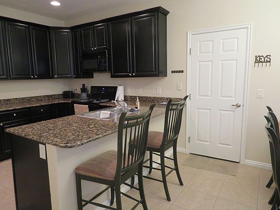 Kitchen/bar area - door to garage