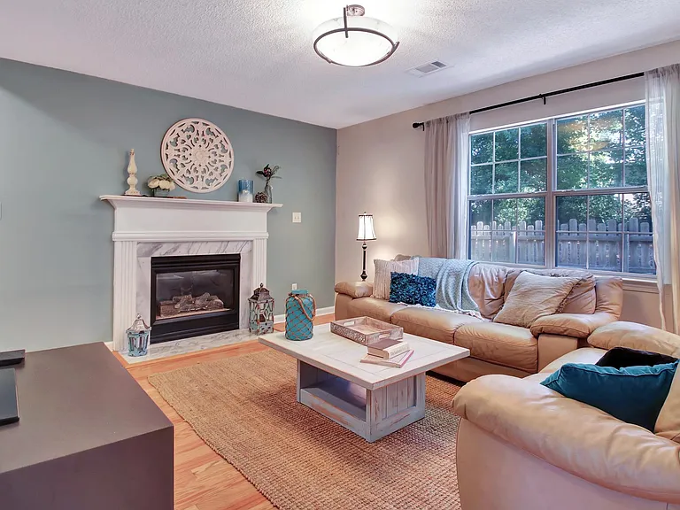 Living room with gas fireplace and smart TV