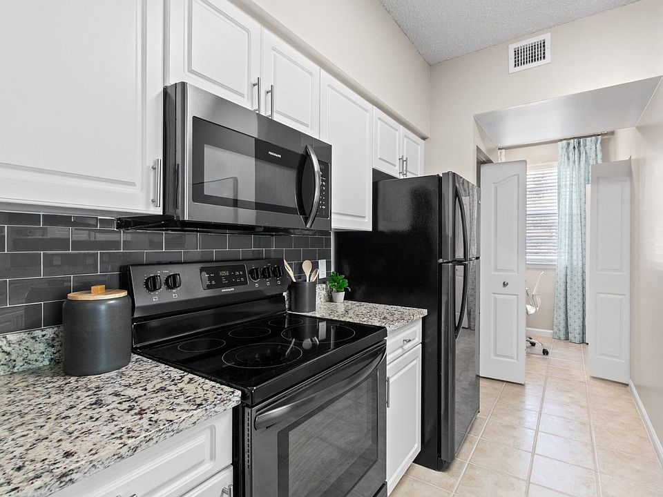 Kitchen with Stainless Steel Appliances at Verona at Boynton Beach Apartments in Boynton Beach, FL 33426