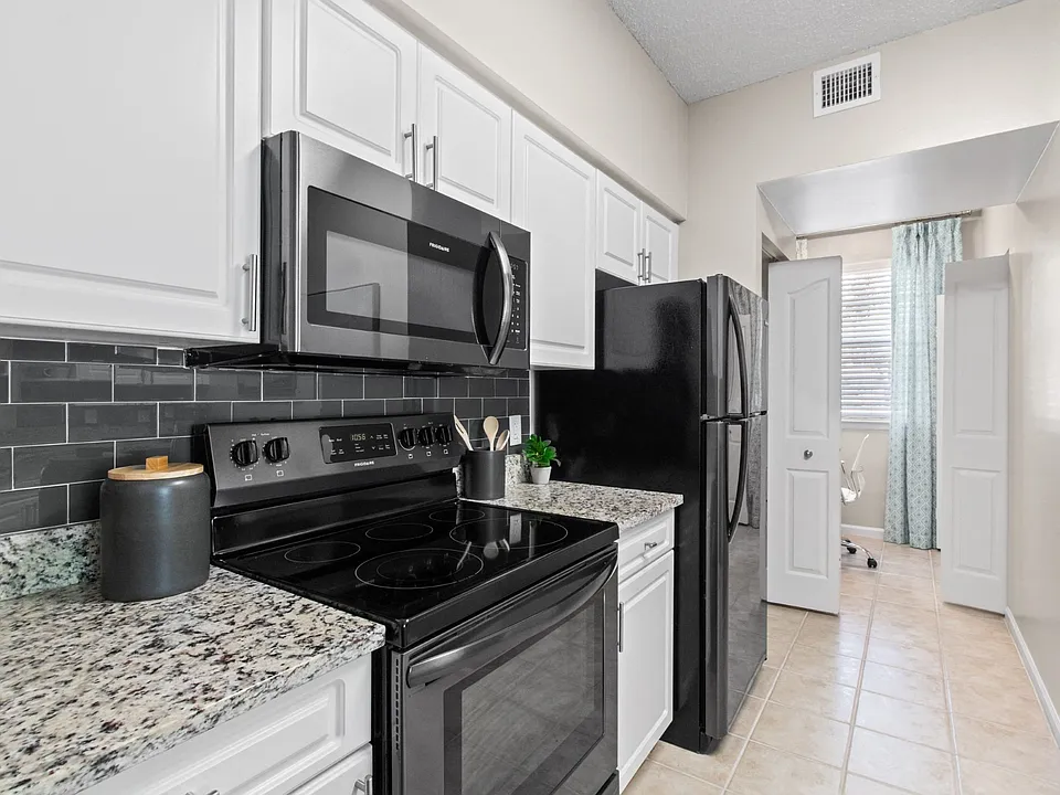 Kitchen with Stainless Steel Appliances at Verona at Boynton Beach Apartments in Boynton Beach, FL 33426