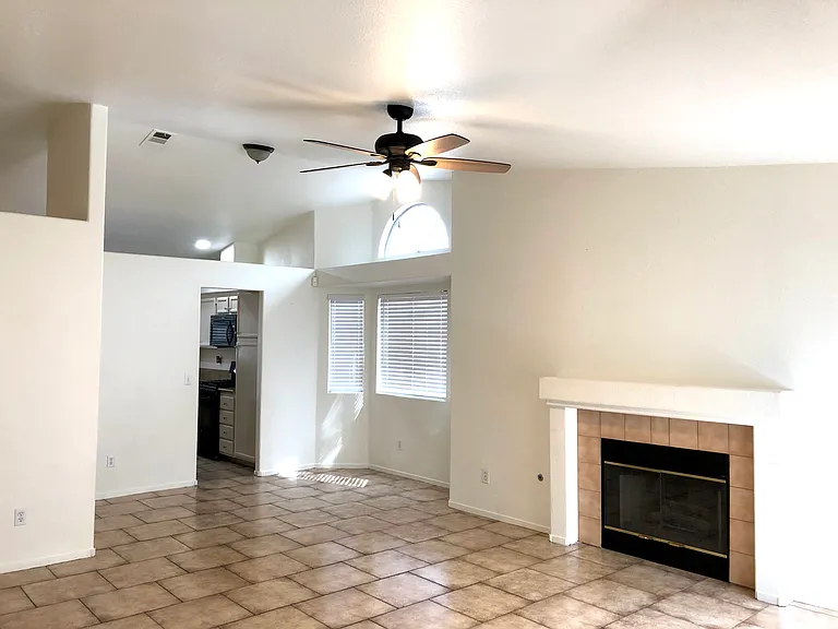 Great room with fireplace and bay windows; can be used for addt'l seating area or space for kid's playroom.