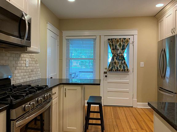 Updated kitchen with granite counter tops, stainless steel appliances and wood floors.