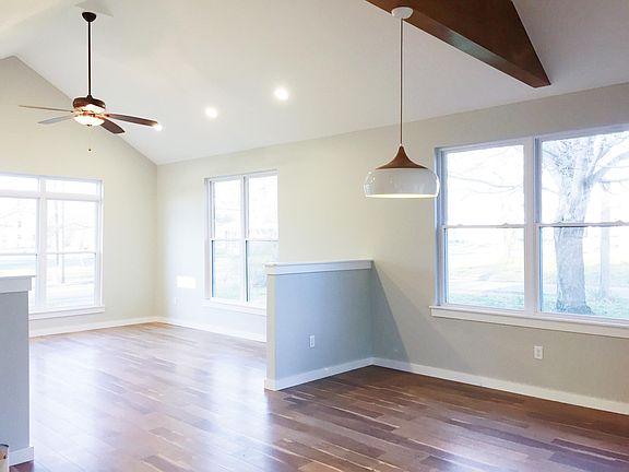 Small half walls divide the living and dining areas.