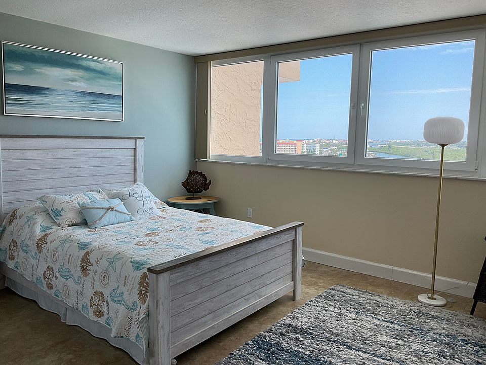 This generous in size bedroom offers a fabulous expansive view of the Gulf of America as well as the intracoastal waterways.