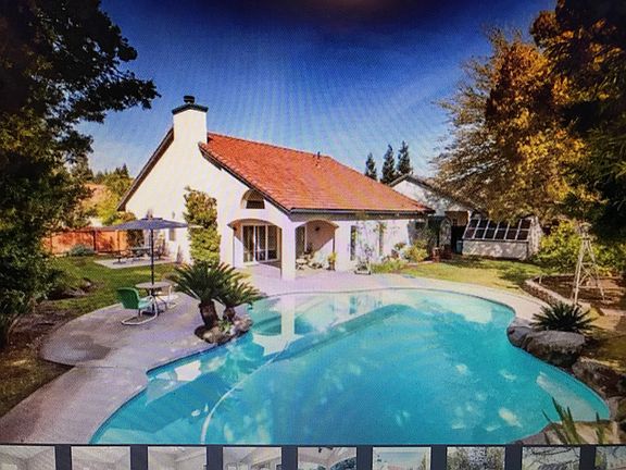 Private yard , 5 fruit bearing trees. Green house, covered patio.