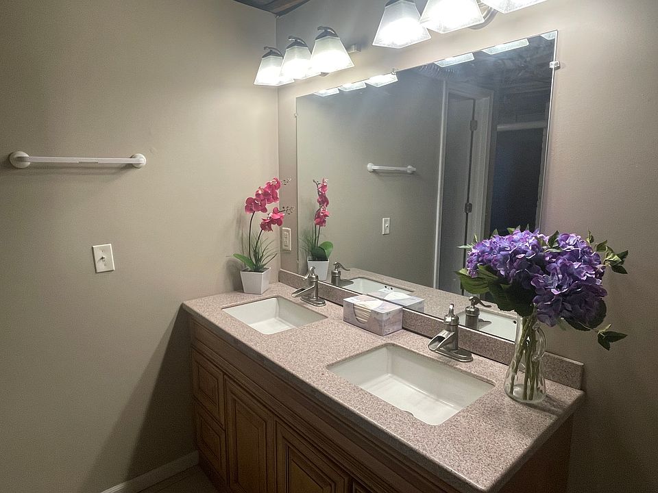 Ample counter space with mirror for both sinks.