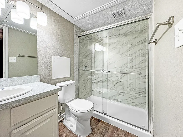 Refresh in your clean, well-lit bathroom featuring updated fixtures.